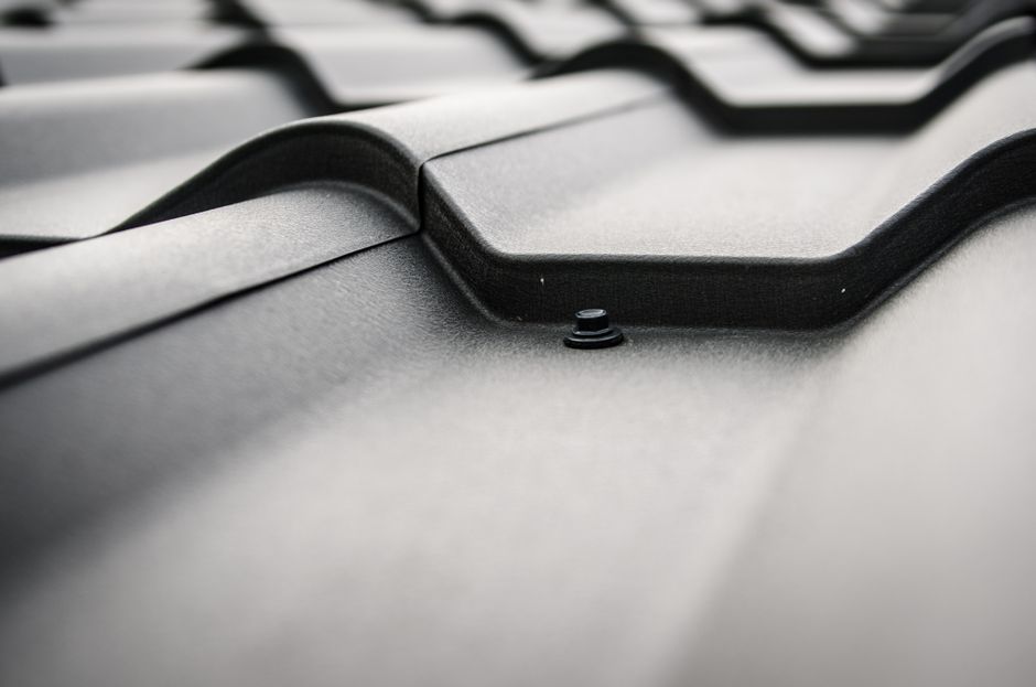 Metal roof installation showing modern roofing techniques and professional completion of home exterior work