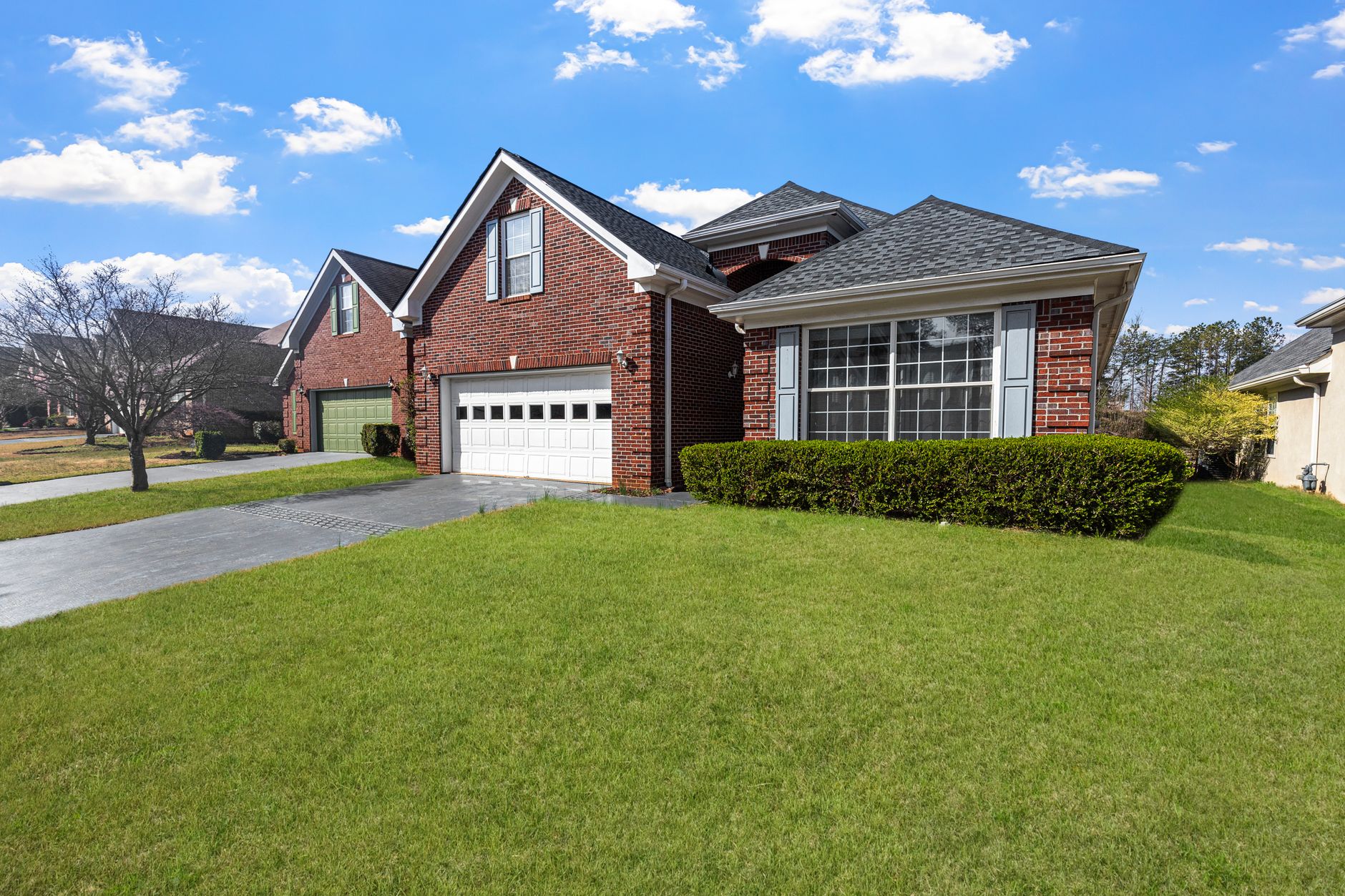Classic New England colonial home with well-maintained landscaping and professional curb appeal