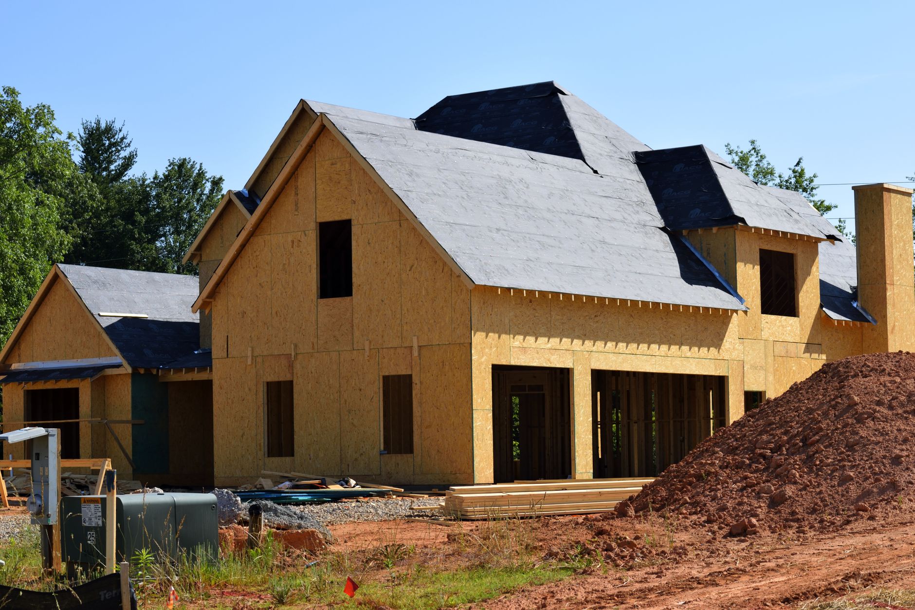 Historic New England home undergoing professional roof restoration with period-appropriate materials and craftsmanship